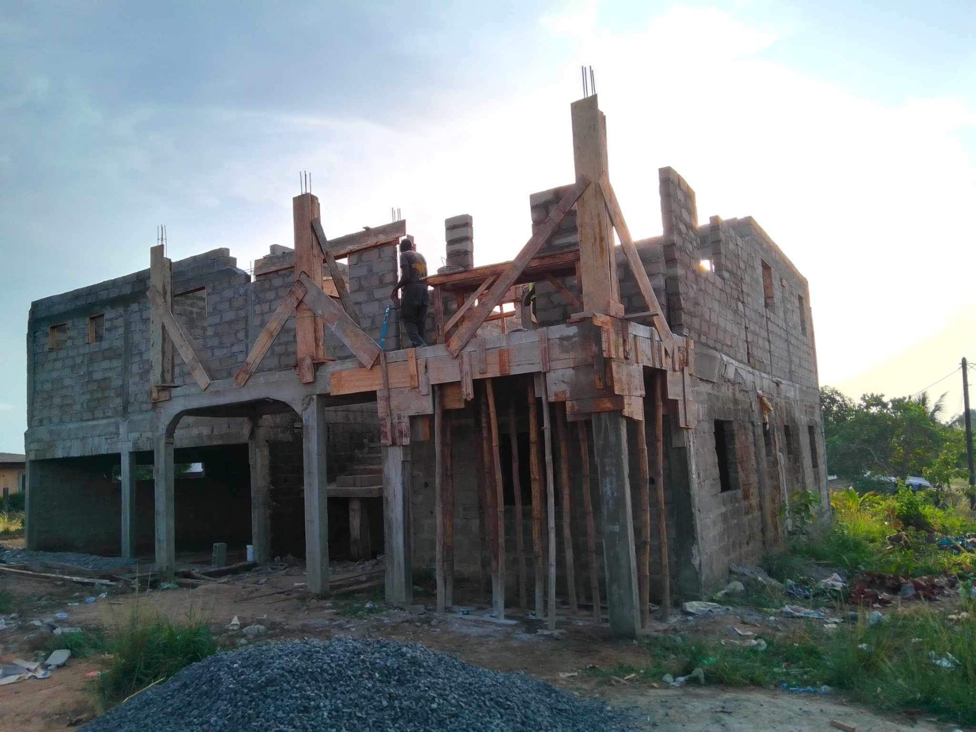 Reinforced concrete columns and timber bracing on residential build