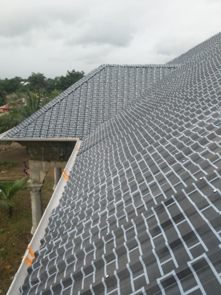 Stone-coat metal roof installation, Liberia
